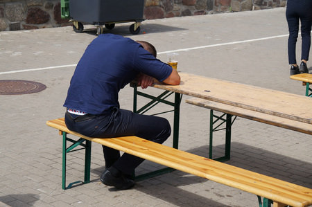 Man depressed with beer. People abuse and alcoholism problems.の写真素材