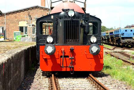 The front view of an old steam locomotive, which stands on a siding                      の写真素材