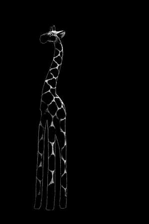 The side view on a wooden sculpture, a giraffe                      の写真素材