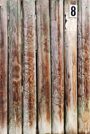 The close-up of a wall formed from round planks                     の写真素材