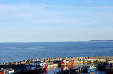 Sassnitz, Mecklenburg Western Pomerania / Germany  April 06: Two people looking on April 06, 2013 over the quai wall in the harbor of Sassnitz.           のeditorial素材