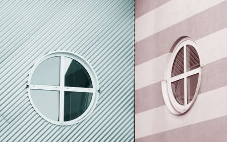 The photograph of a modern house facade made of corrugated sheet metal and patterned plaster facade               の写真素材