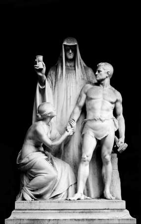 Wiesbaden, Germany - September 23, 2013  The sculpture of a worker and a woman kneeling in front of the time from an unknown artist on September 23, 2013 in Wiesbaden のeditorial素材