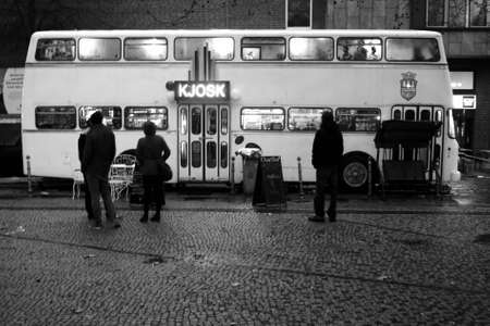 Berlin, Germany - January 2, 2012  People are facing a double-decker Bus that was converted into a kiosk on January 02, 2012 in Berlin                    のeditorial素材