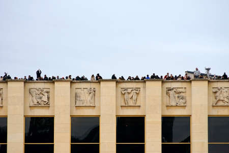 Paris, France - December 29, 2013  Tourists stand on a platform at the Champ de Mars and photograph the Eiffel Tower on December 29, 2013 in Paris                  のeditorial素材