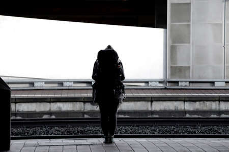 The photograph of a backpacker on a platform                   