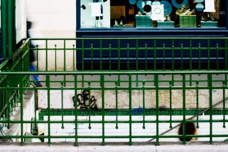 The photograph of the railing of a subway exit                