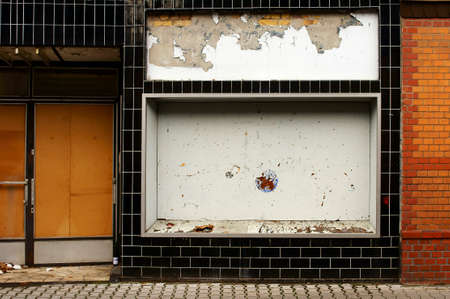 The photograph of the ruins of an old, abandoned movie theater with display windows and entrance                    の写真素材