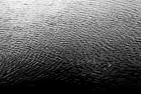 The top view of a water surface with many small waves                  の写真素材