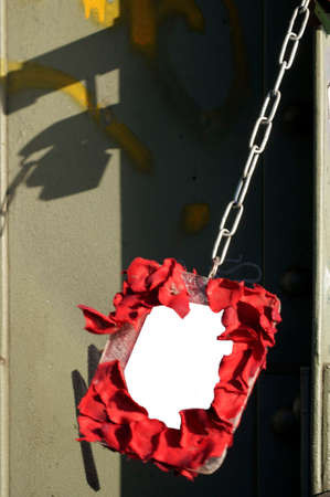 The photograph of a hanging picture frame on a bridge pier                  の写真素材