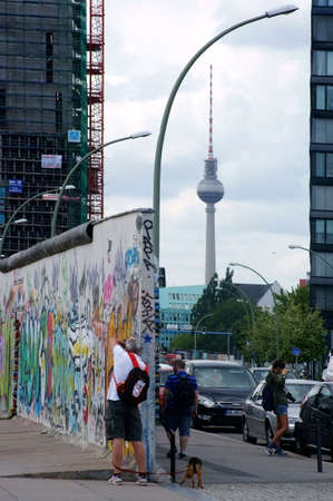 Berlin, Germany, June 16, 2014  Tourists photographing a piece of the Berlin Wall at the East Side...