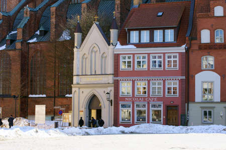 Stralsund, Germany - April 2, 2013  The main entrance of the St  Nikolai church with the adjacent...
