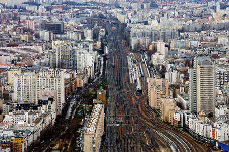 Paris, France - December 31, 2013  Railway tracks, rails and infrastructure with high-rise buildings...