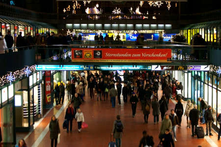 Hamburg, Germany - December 29, 2013: The festively decorated shopping arcade of the Hamburg main station with unknown travelers on December 29, 2013 in Hamburg.のeditorial素材