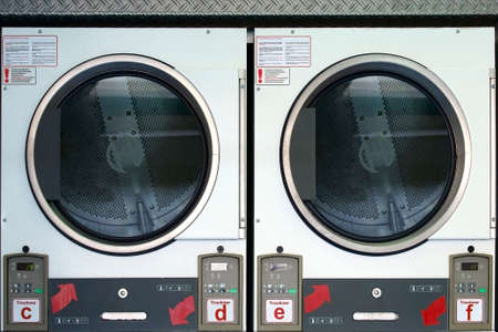 The photograph of stacked dryers in a laundromat.