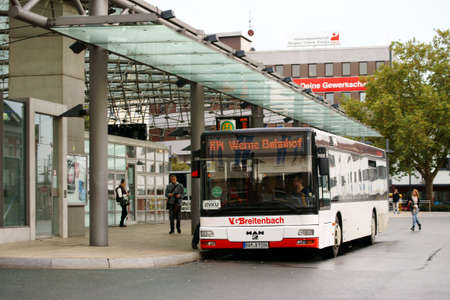 Hamm, Germany - October 09, 2014: People board a bus of the public transport at the bus station on the station forecourt on October 09, 2014 in Hamm.のeditorial素材