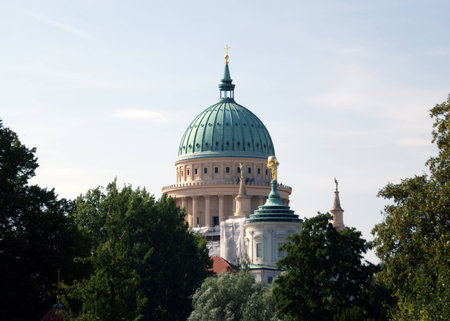 Potsdam, Germany - August 15, 2009: The outstanding dome of the St. Nicholas Church behind trees on August 15, 2009 in Potsdam.のeditorial素材
