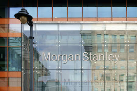 London, UK - November 29, 2014: The facade of modern bank building from Morgan Stanley with reflections and a nostalgic lantern on November 29, 2014 in London.のeditorial素材