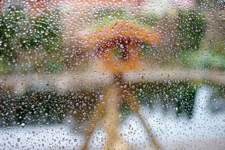 The photograph of raindrops on a window pane.の写真素材