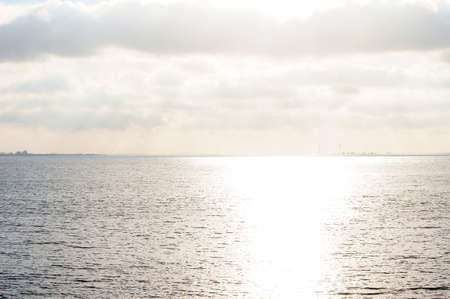 The sea, Lake IJssel,  at Volendam in the Netherlands in backlit.の写真素材