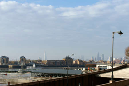 London, UK - November 28, 2014: A construction site in the financial center on the banks of the River Thames in Canary Wharf in front of the skyline and skyscrapers of Southwark on November 28, 2014 in London.のeditorial素材