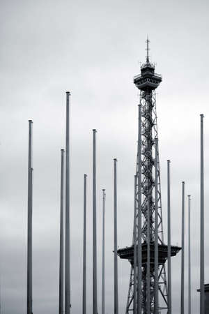Berlin, Germany - April 8, 2015: The steel construction of the Berlin Radio Tower stands behind a row of flagpoles on April 08, 2015 in Berlin.のeditorial素材