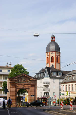 Mainz, Germany - July 10, 2015: A photographer and another person standing in front of the Gautor in the old town of Mainz with the St. Stephen's Church in the background on July 10, 2015 in Mainz.のeditorial素材