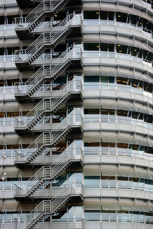 A walk outside a office building made of metal with stairs.の写真素材