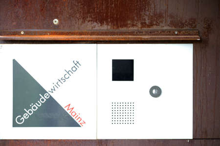 Mainz, Germany - July 17, 2015: The entrance sign and intercom at the entrance of the building of the premises of economic Mainz at the Citadel on July 17, 2015 in Mainz.のeditorial素材