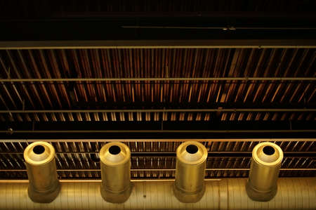 The bottom view of a ventilation duct which is connected under the roof of a building.の写真素材