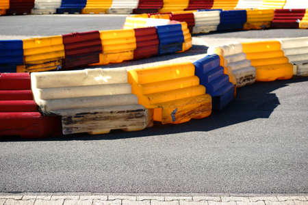 A go-kart track with limitations and a roadway.の写真素材