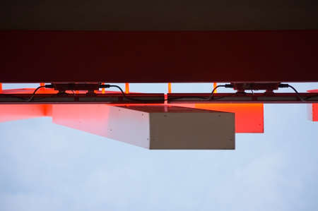 The bottom view and a detail of an illuminated red neon sign.の写真素材