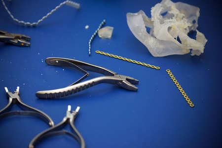 Pliers and other laboratory tools laying on a bench a of a 3D printing.の写真素材