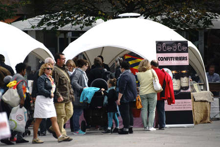 Mainz, Germany - September 4, 2015: The stalls of the weekly market in Mainz with visitors on the...