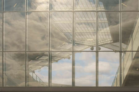 A transparent partition wall on the corner and the roof of a soccer stadium.