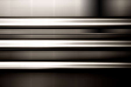 Three parallel-mounted stainless steel pipes at a blurred facade.の写真素材