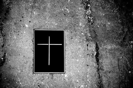 The the rock grave with a lid or closure with cross symbol.の写真素材