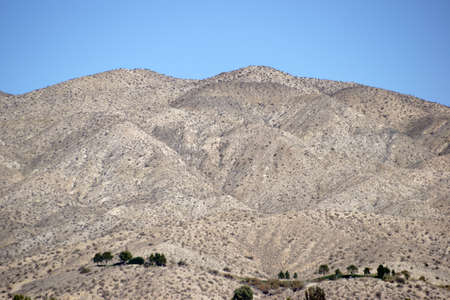 Sand-like bright and round hill in the Mojave Desert in Yucca Valley.の写真素材