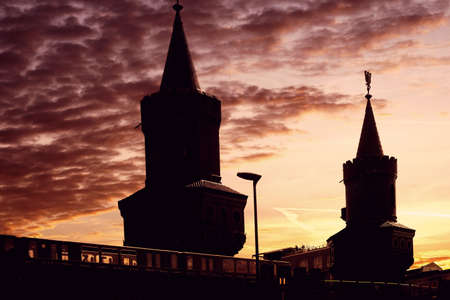 Berlin, Germany - May 09, 2016: A yellow metro crosses the Oberbaum Bridge over the river Spree during a sunset on May 09, 2016 in Berlin.のeditorial素材