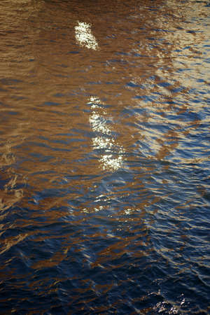 The fluctuations of light on the water surface of a water channel.