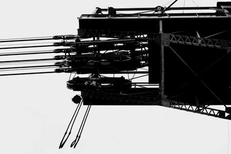 A high-voltage tower with cable winches and platforms.の写真素材