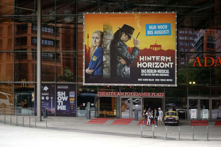 Berlin, Germany - June 21, 2016: Theatre visitors standing next to a car of the brand Trabant at the entrance portal of the theater at the Potsdam Square on June 21, 2016 in Berlin.のeditorial素材