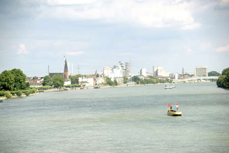 The district Wiesbaden Biebrich behind the River Rhine with industrial areas and infrastructure.の写真素材