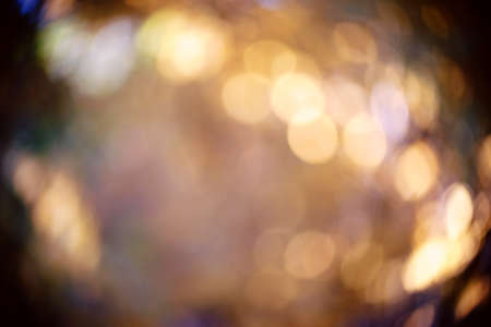 The colorful light circles of a blurred photography in the backlight.