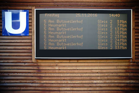 A digital display panel with the departure times for the subway in Cologne.                              の写真素材