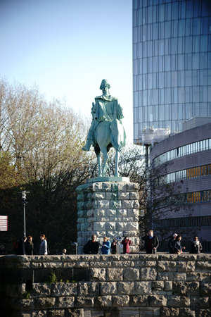Cologne, Germany - November 24, 2016: Visitors are standing under a horseman statue of a Prussian king on a viewing platform of the Hohenzollern Bridge on November 24, 2016 in Cologne.のeditorial素材