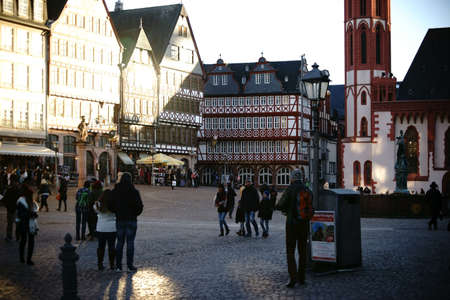 Frankfurt, Germany - January 05, 2017: Visitors and tourists are visiting the Roman Mountain with historic buildings and the Justice Fountain on January 05, 2017 in Frankfurt.のeditorial素材