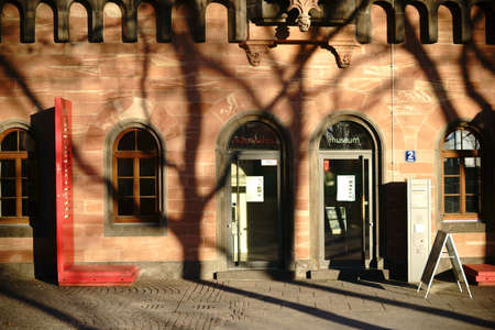 Frankfurt, Germany - January 05, 2017: Trees cast shadows on the facade of the History Museum illuminated by the sunlight on January 05, 2017 in Frankfurt.のeditorial素材