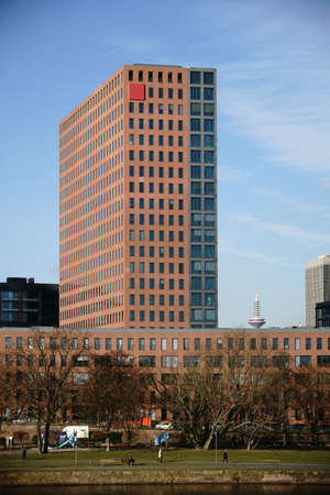 High-Rise building and the top of the Europe Tower behind the River Main in Frankfurt.