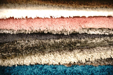 The close-up of fabric fluff and floor coverings of stacked carpets.の写真素材